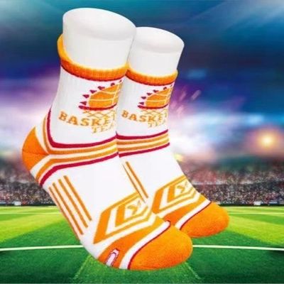 Des chaussettes de sport orange de luxe pour un confort étirant et un football antidérapant