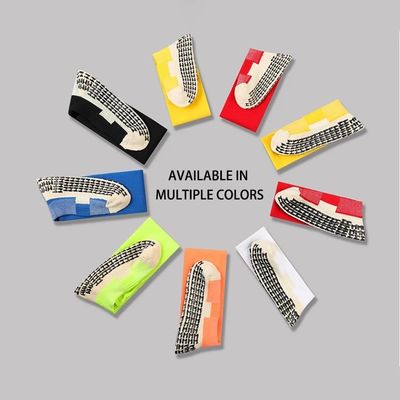 Tissu élastique en polyamide solide Anti-dérapant doux Soccer Sport Soccer Longues chaussettes à poignée